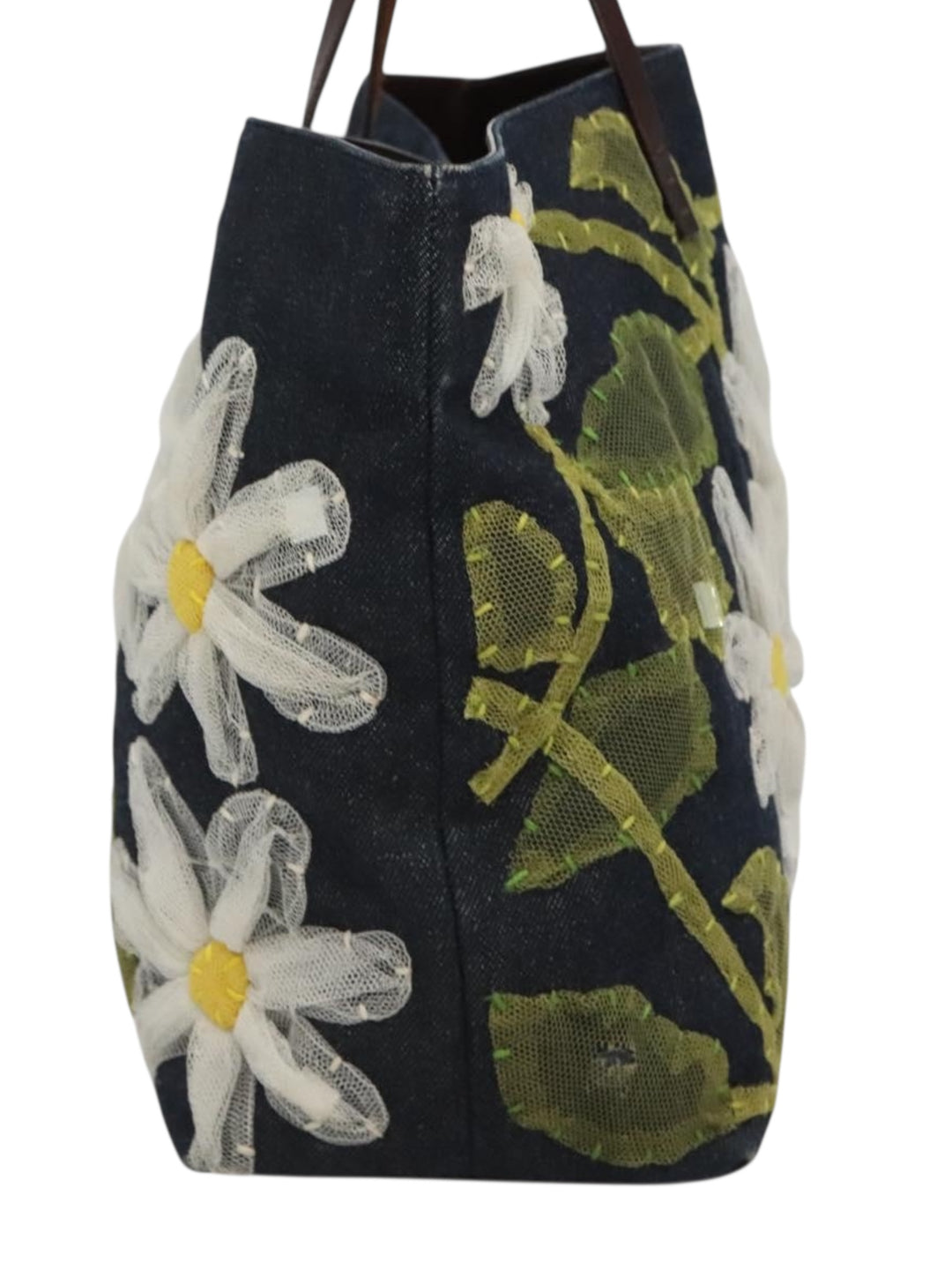1990s Fendi Daisy Appliqué Denim Tote with Leather Handles - Side angle showing the tote's dimensions and shape on display.