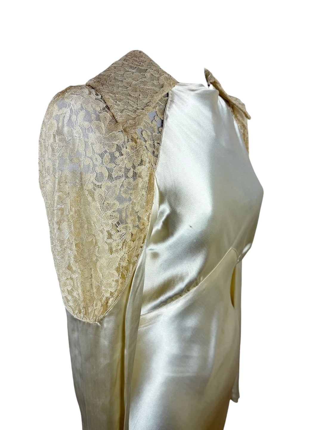 Vintage-style garment with lace detailing on a white background