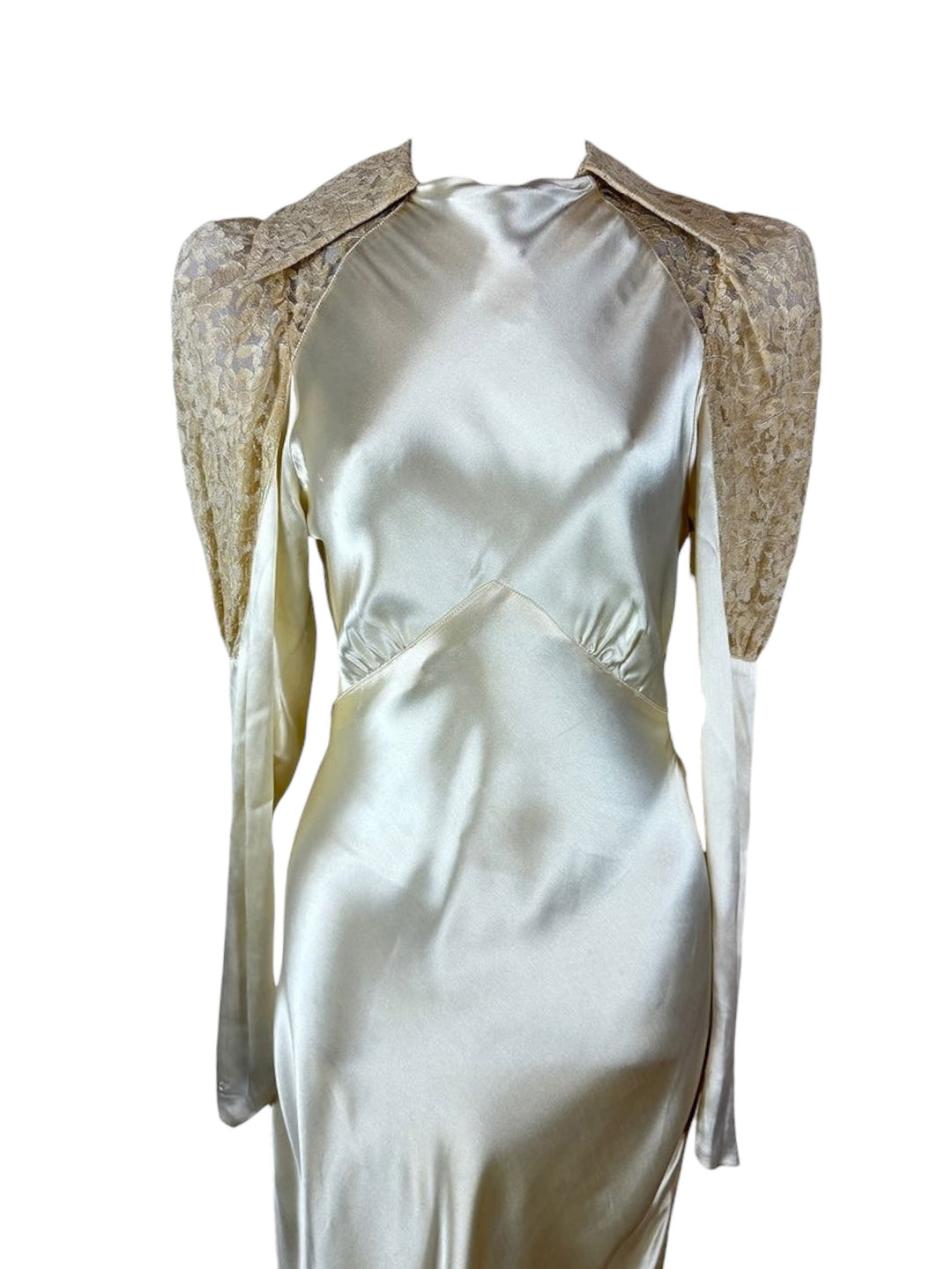 White dress with lace shoulder details on a white background