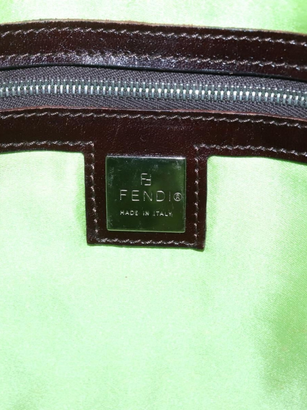 1990s Fendi Daisy Appliqué Denim Tote with Leather Handles - Interior view showing green fabric lining and zip pocket.