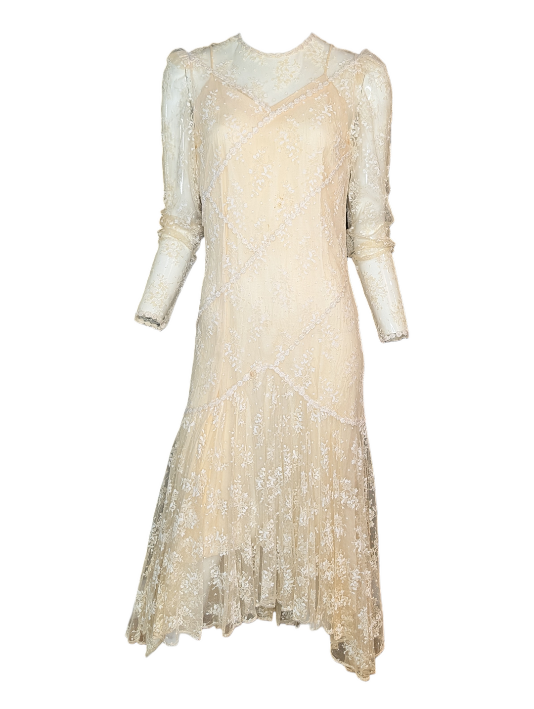 Beige dress with lace details on a white background