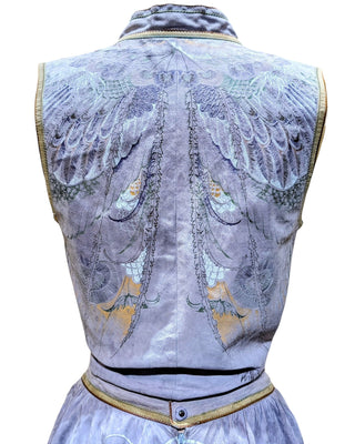 A sleeveless lavender-gray vest with ornate embroidered wings and floral motifs on the back, shown against a plain white background.