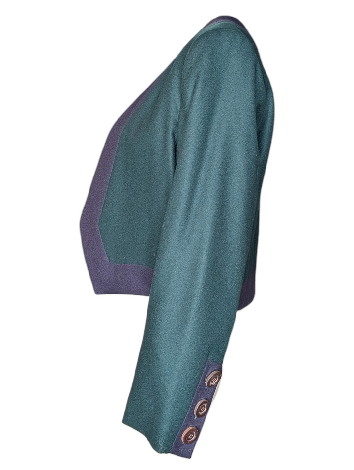 Side profile of YSL cropped jacket highlighting tailored wool structure