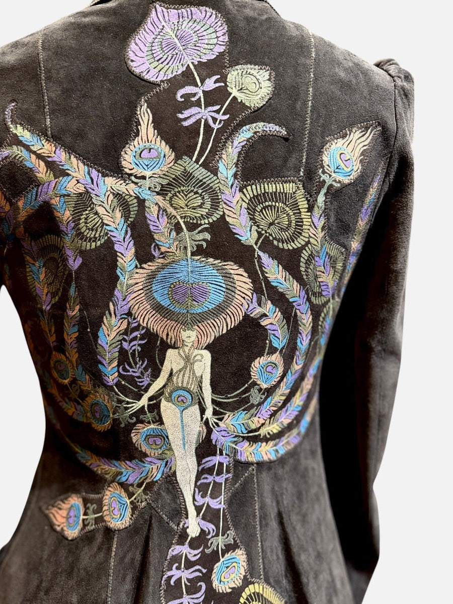 A dark black suede jacket shown from the back, featuring elaborate, colorful hand-embroidered and painted floral, insect, and human figure motifs across the back panel.