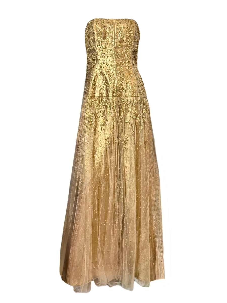 Unworn Ralph Lauren Fall 2006 strapless gold couture gown displayed on mannequin with hand-beaded floral embroidery and full tulle skirt.