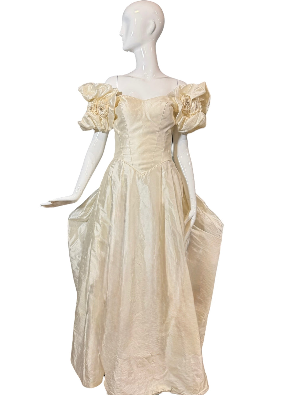 Close-up of the vintage Priscilla of Boston wedding gown silk taffeta fabric, highlighting the intricate floral puff sleeves and rosettes, perfect for a vintage wedding gown.