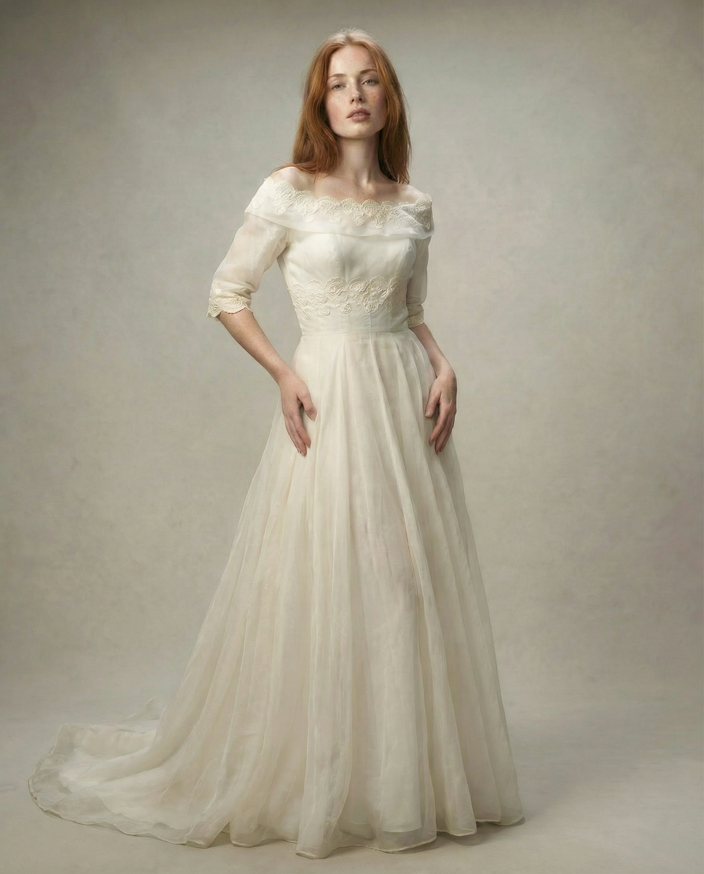 Woman wearing a white wedding dress with a plain background