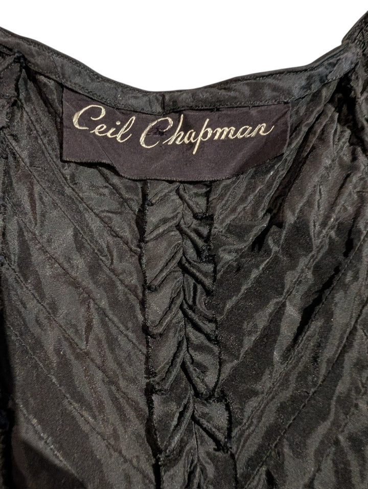 Black garment with 'Ceil Chapman' label on a white background
