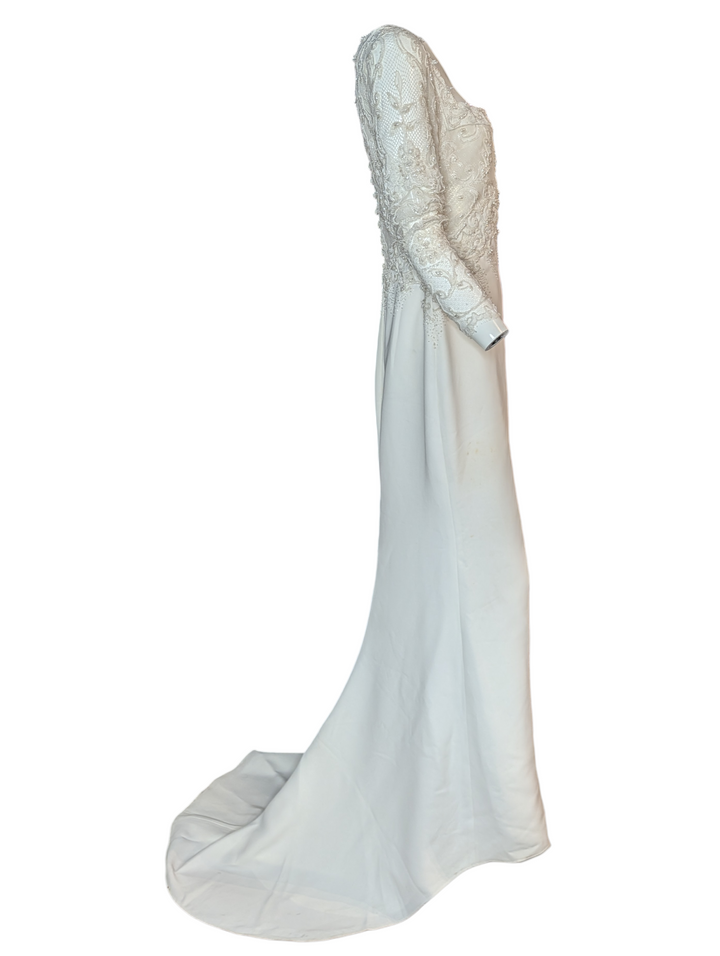 Full back view of Badgley Mischka bridal gown showing lace detailing and extended train