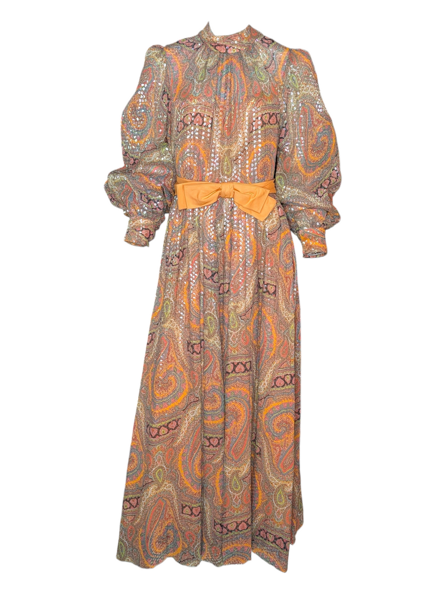 Long patterned dress with a belt on a white background