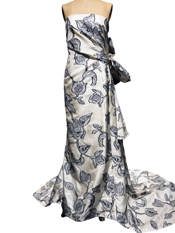 Floral patterned dress on a mannequin against a white background