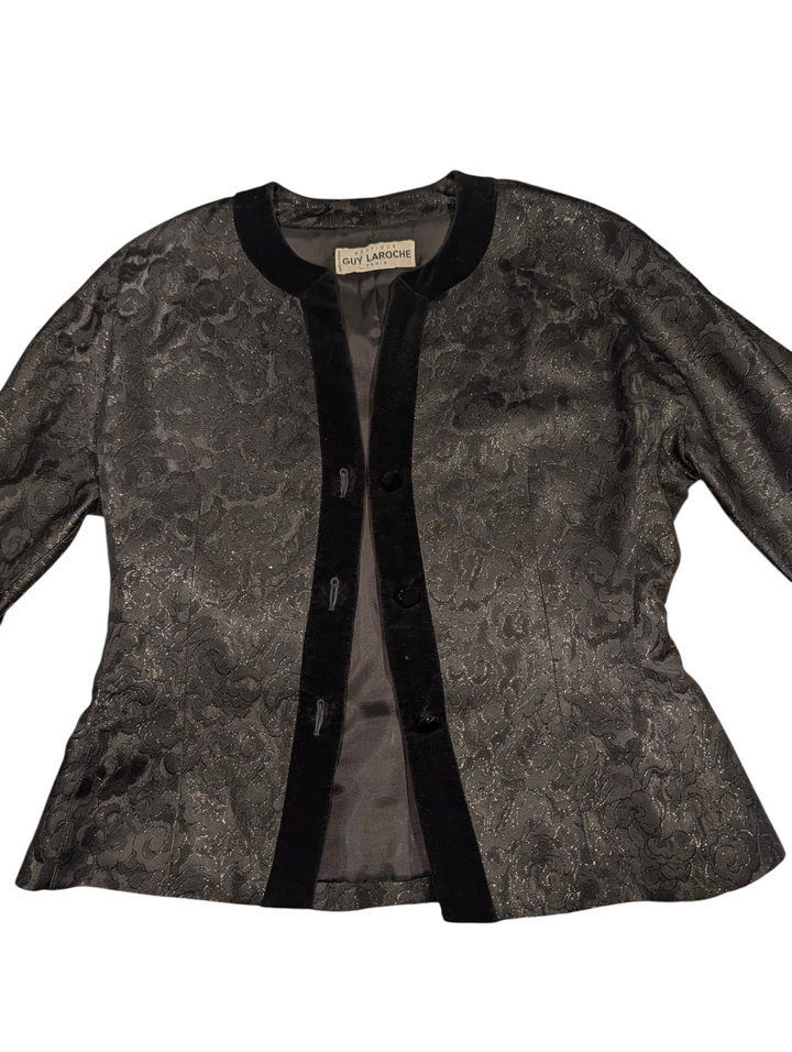 Close-up of velvet-trimmed button front on Guy Laroche evening jacket
