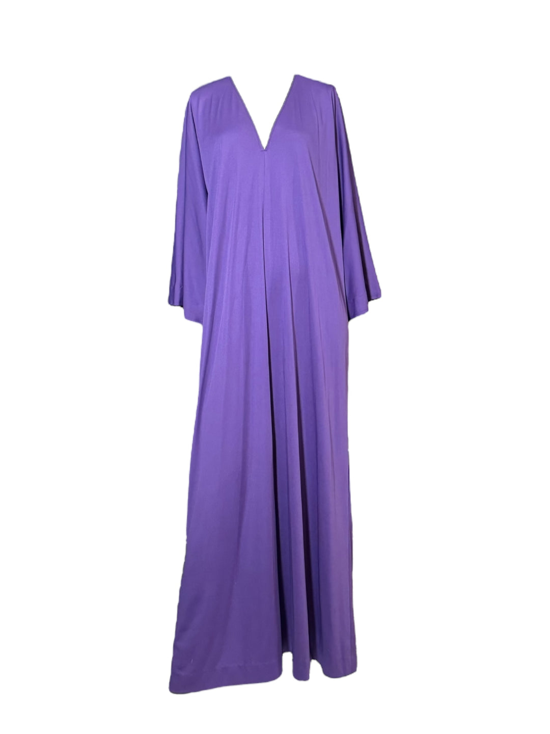Halston Front: Vintage 1970s Halston purple jersey kaftan with deep V-neckline, wide sleeves, and flowing minimalist silhouette on mannequin