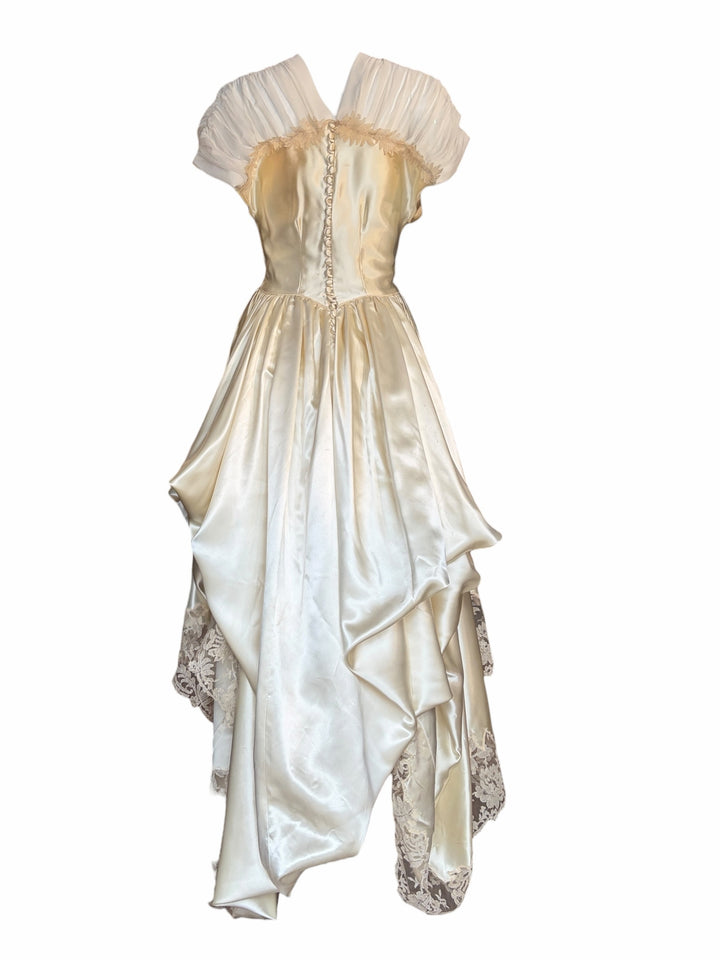 RERACKED vintage cream satin high-low evening gown with sheer pleated sleeves, lace trim, and back button detail.