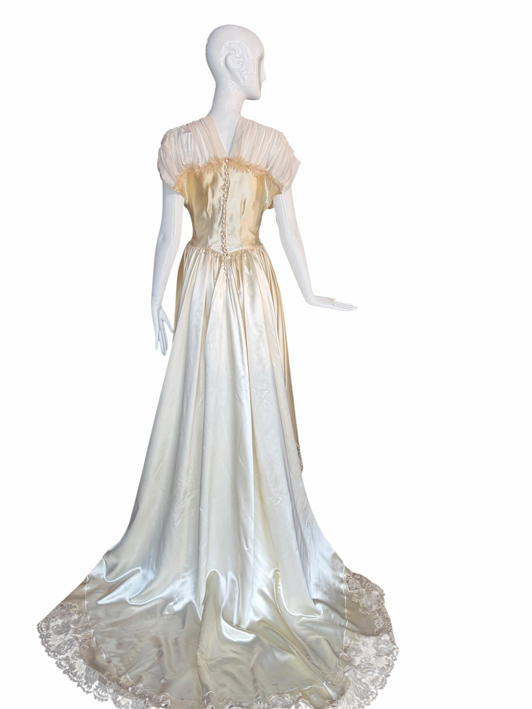 RERACKED vintage cream satin evening gown with lace trim, pleated cap sleeves, and button-down back on a mannequin