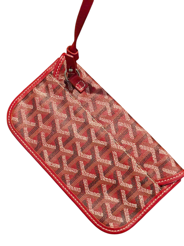 Red Goyardine coated canvas exterior

Natural leather trim and handles

Interior features one main compartment and a zipped pocket

Goyard signature clasp closure