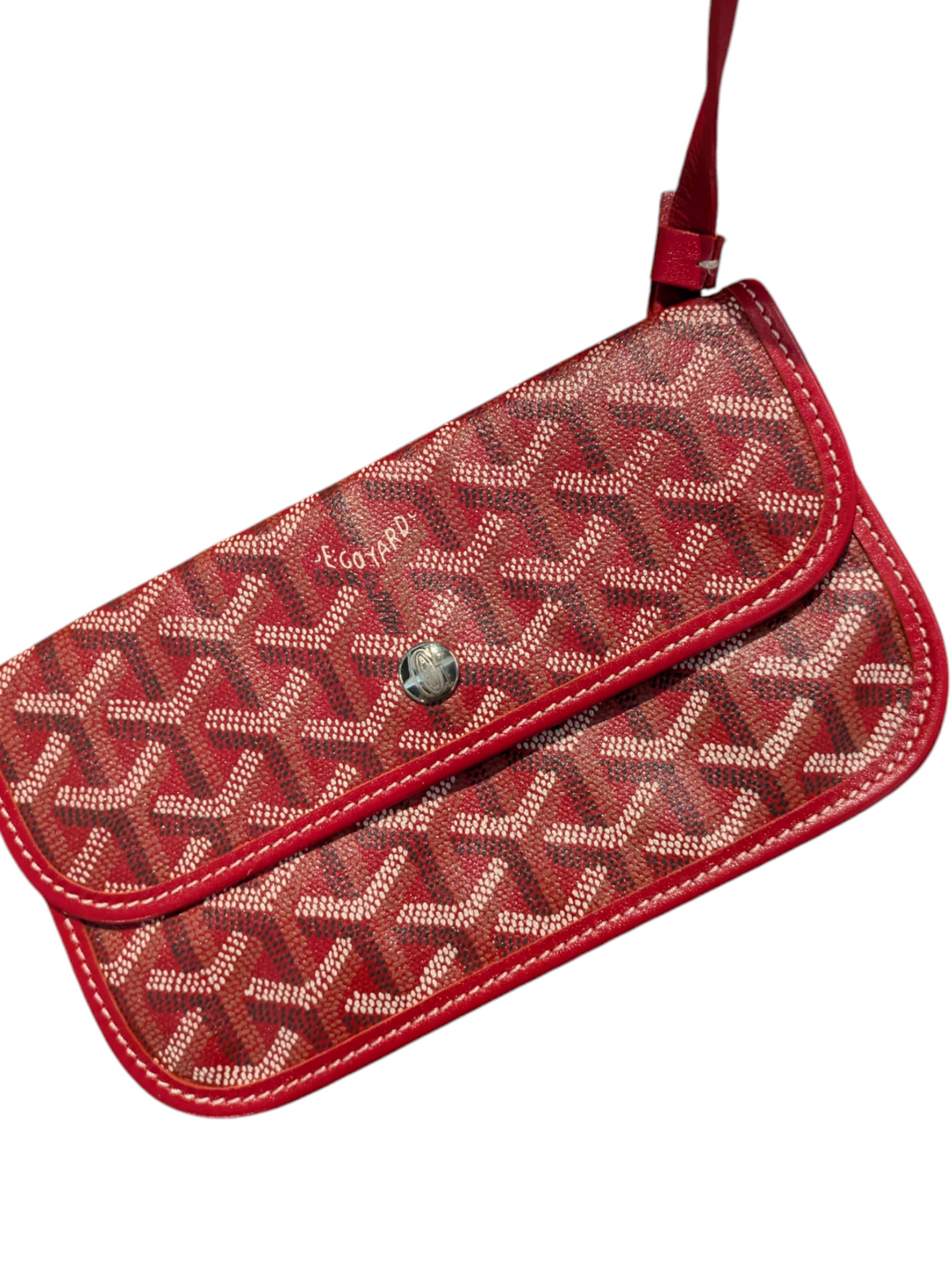 Red Goyardine coated canvas exterior

Natural leather trim and handles

Interior features one main compartment and a zipped pocket

Goyard signature clasp closure